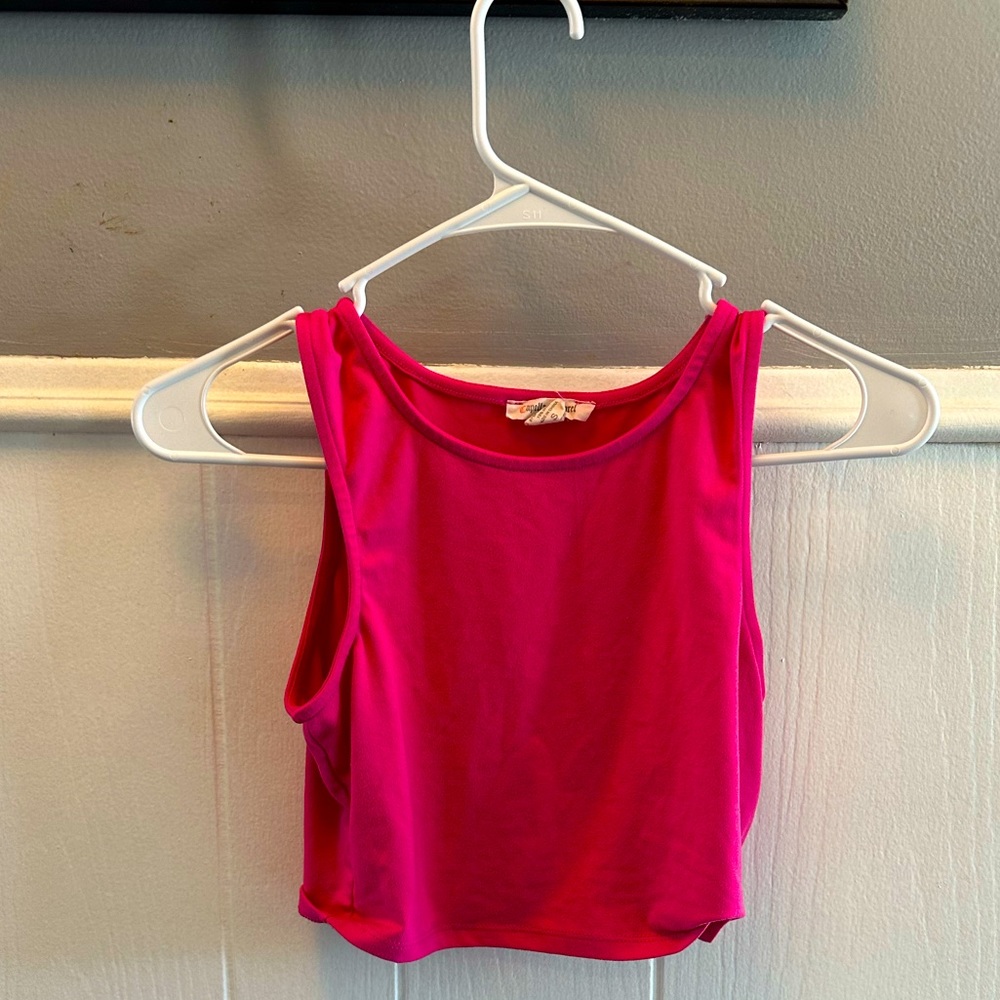 Selling the Pink tank top, og from a traveling boutique. Bought for $15.